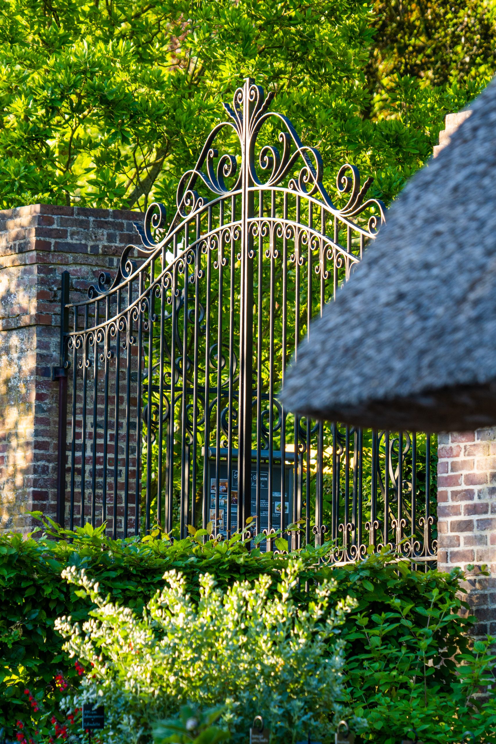 gate at the entrance to the saint siméon farm - luxury hotel france