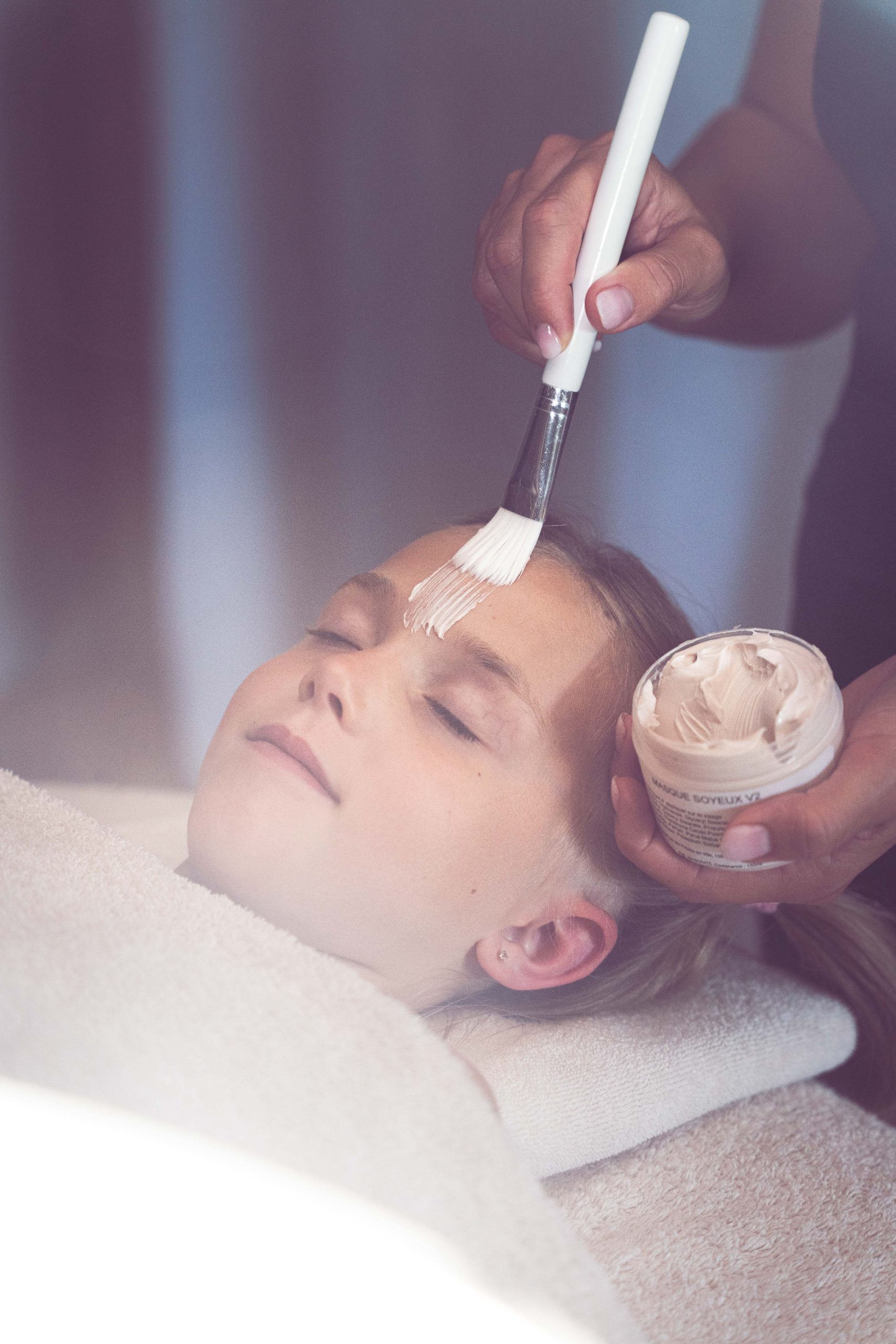 child receiving a facial - honfleur massage